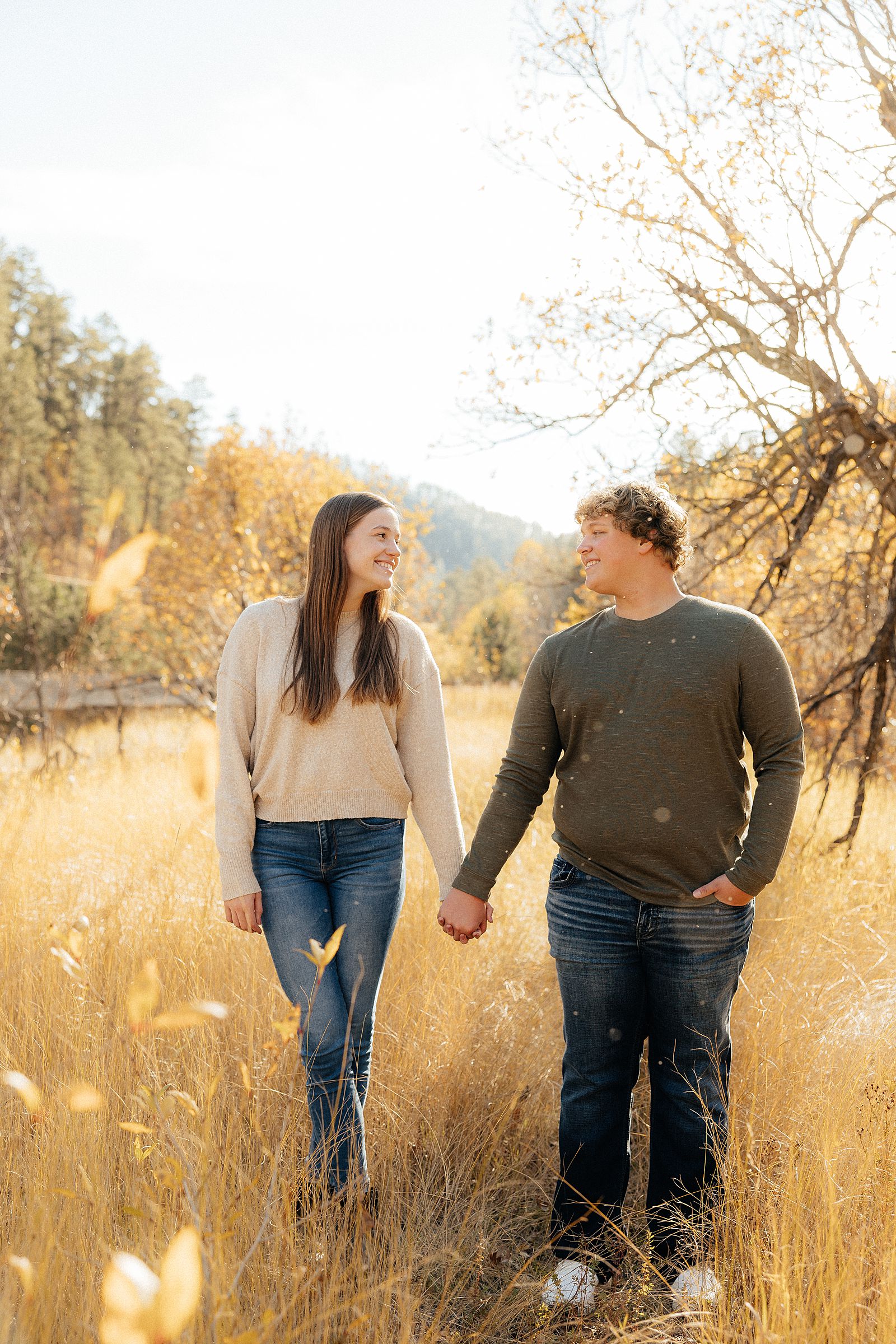 Hannah and Parker standing on a golden pathway.