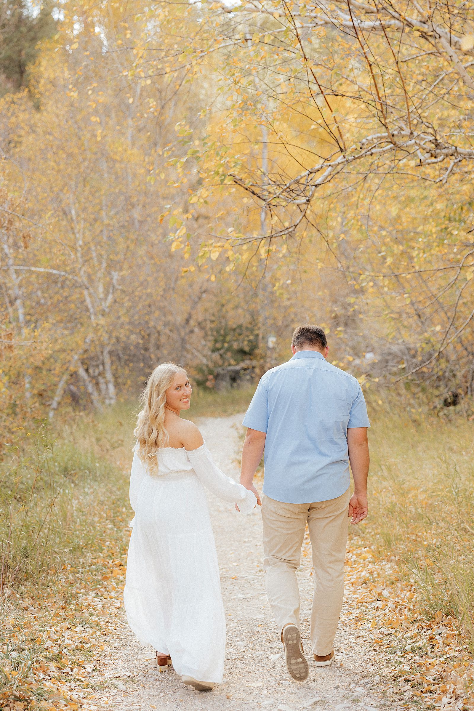 A future bride looking back at the spearfish photographer during her engagement session.