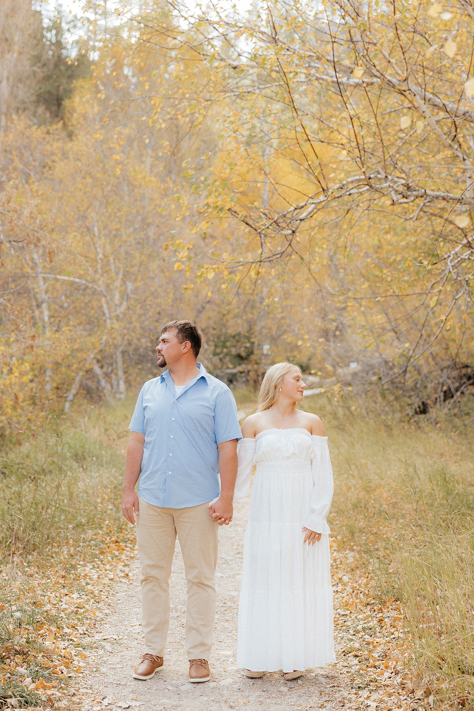 A couple looking off into the distance. Photo taken by a Spearfish photographer.
