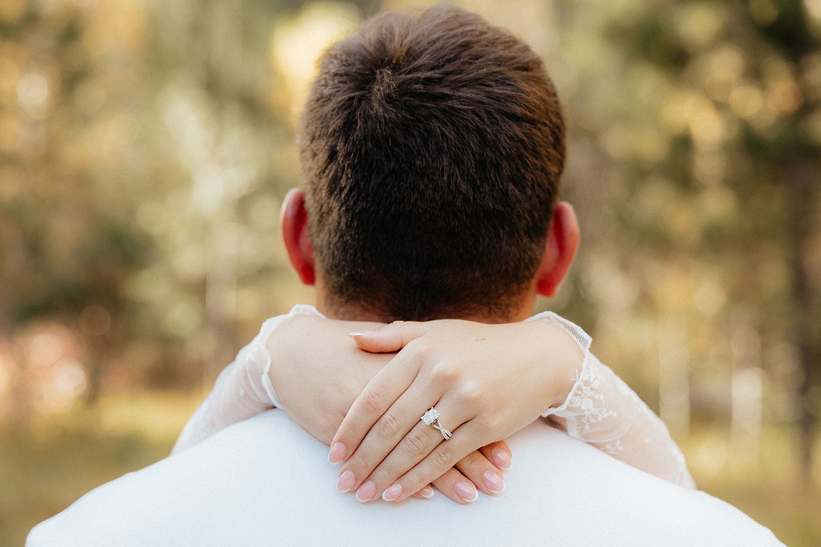 An engagement ring during an engagement session.