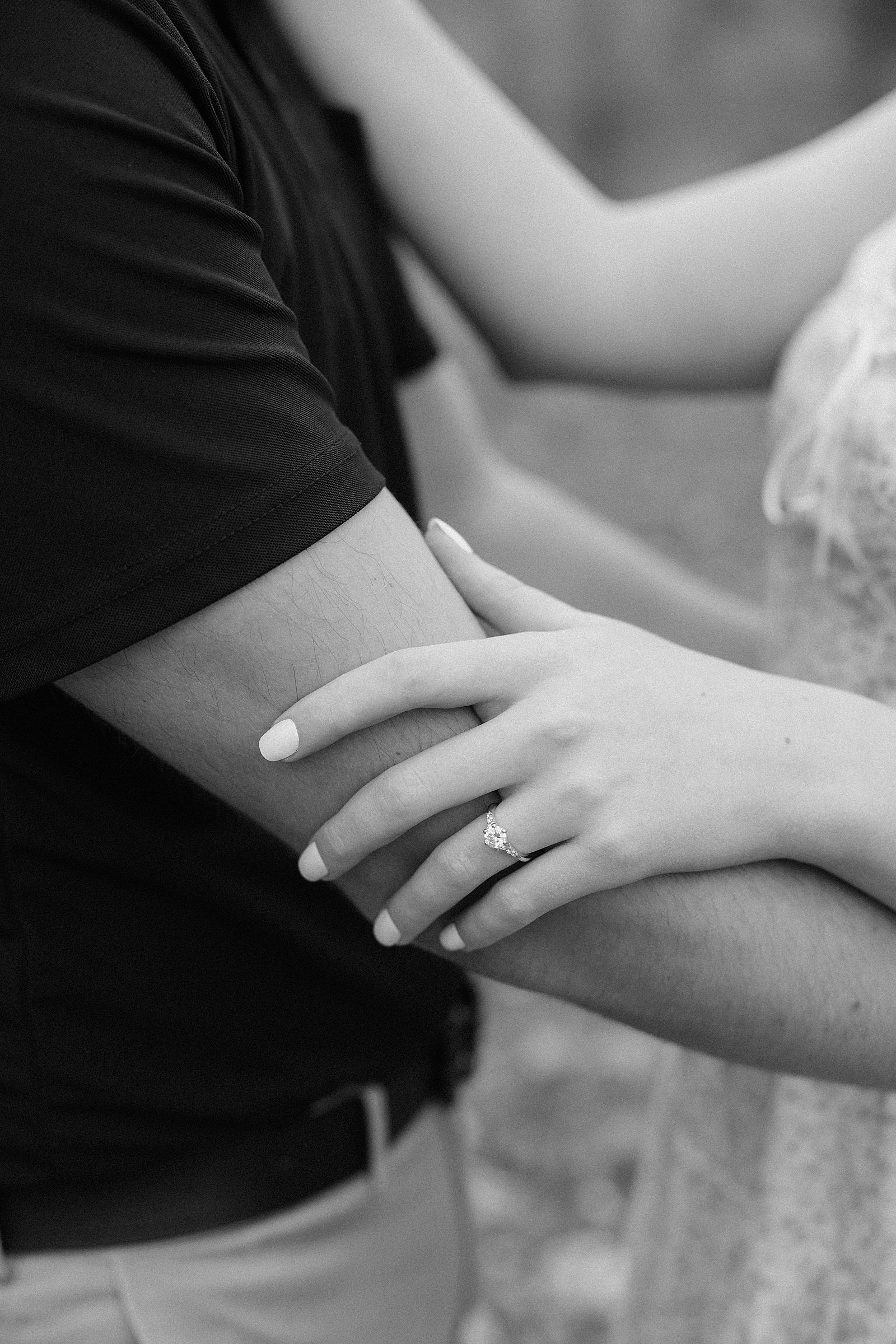 An engagement ring at an engagement session.