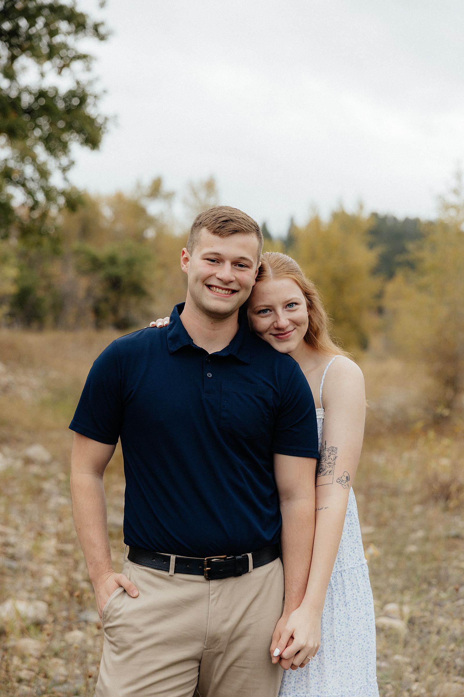 Warren and Olivia smiling at the camera.
