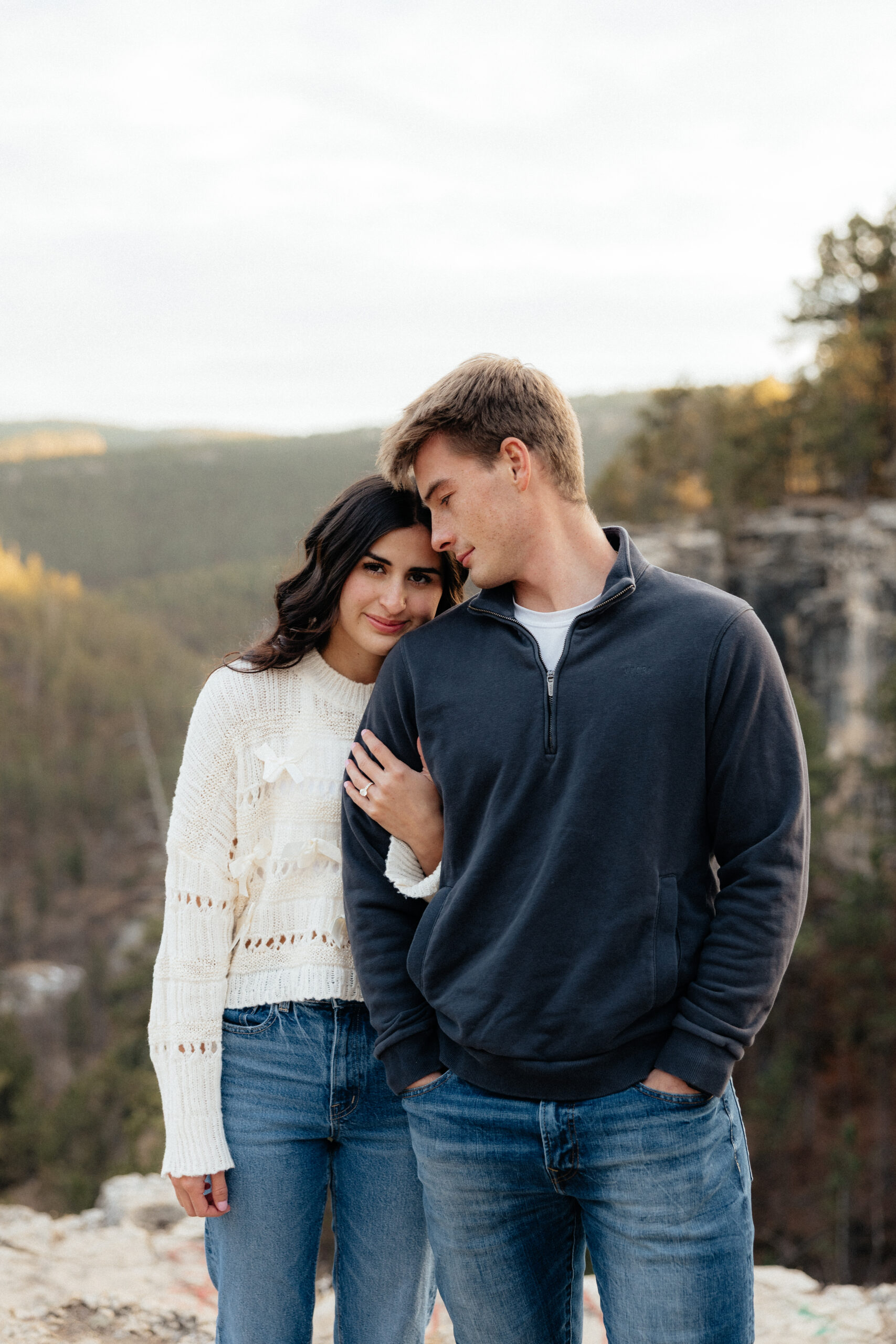A couple at their winter engagement session at falling rock.