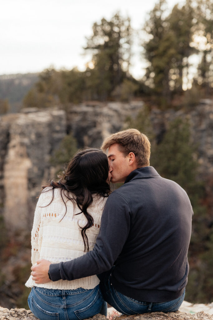 A couple kissing during their engagement session.