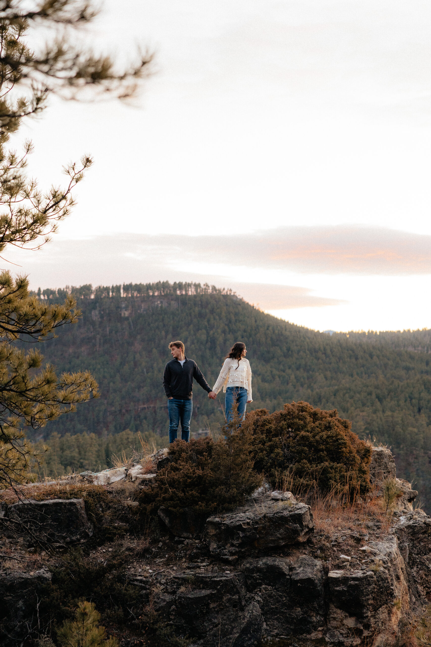 Sam and Savanah standing with the Black Hills in the background.