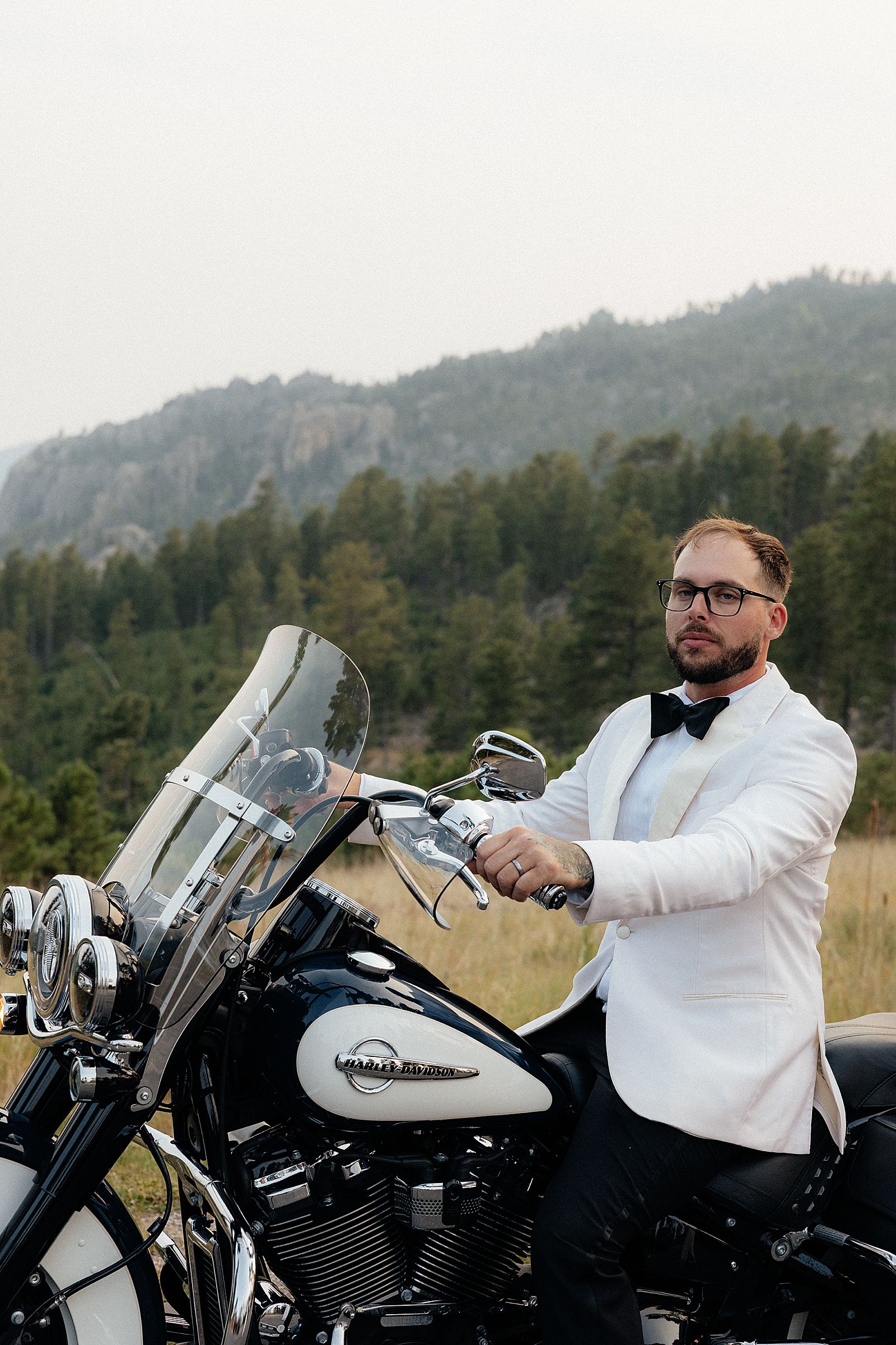 CJ sitting an a motorcycle