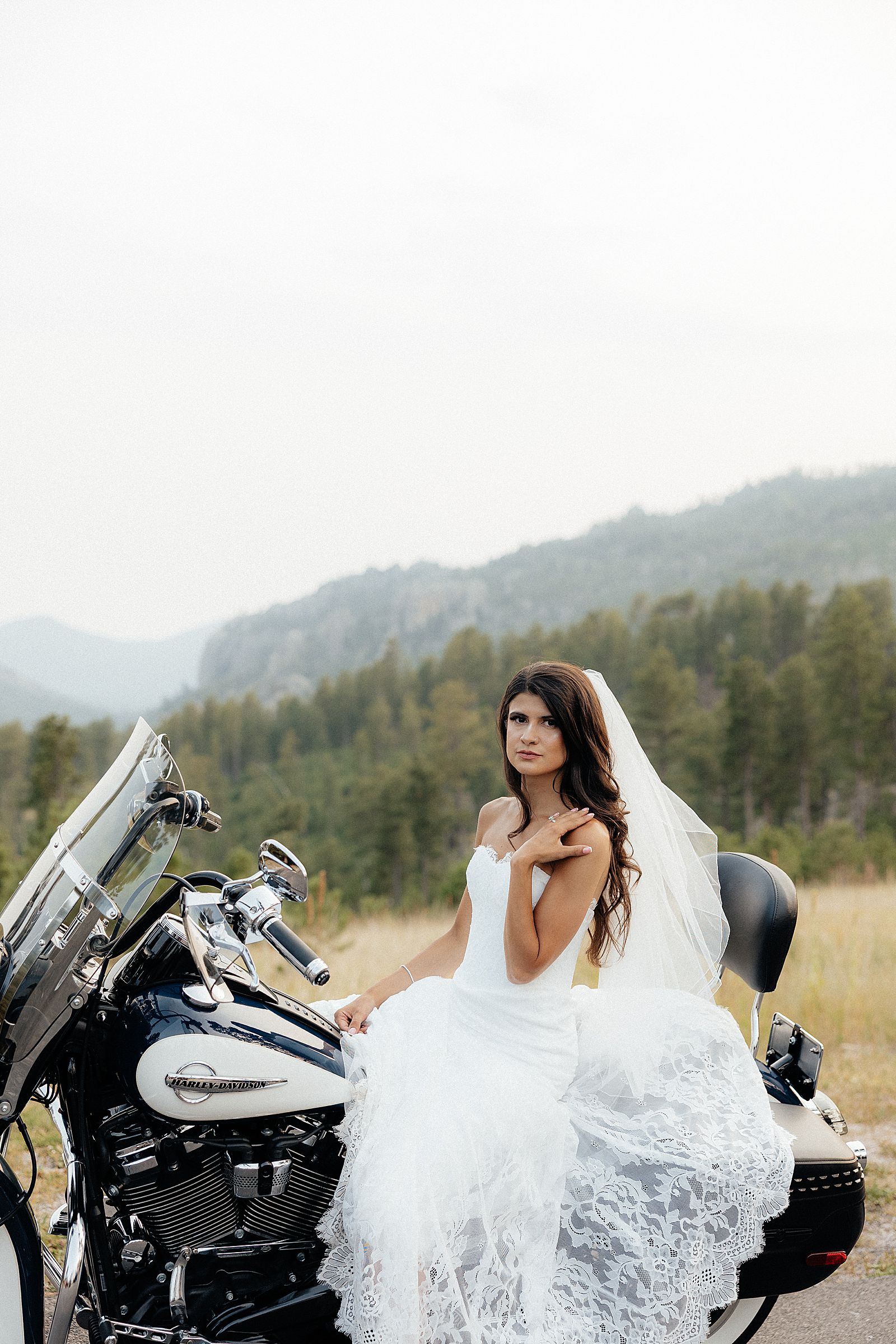 Phoebe sitting an a motorcycle