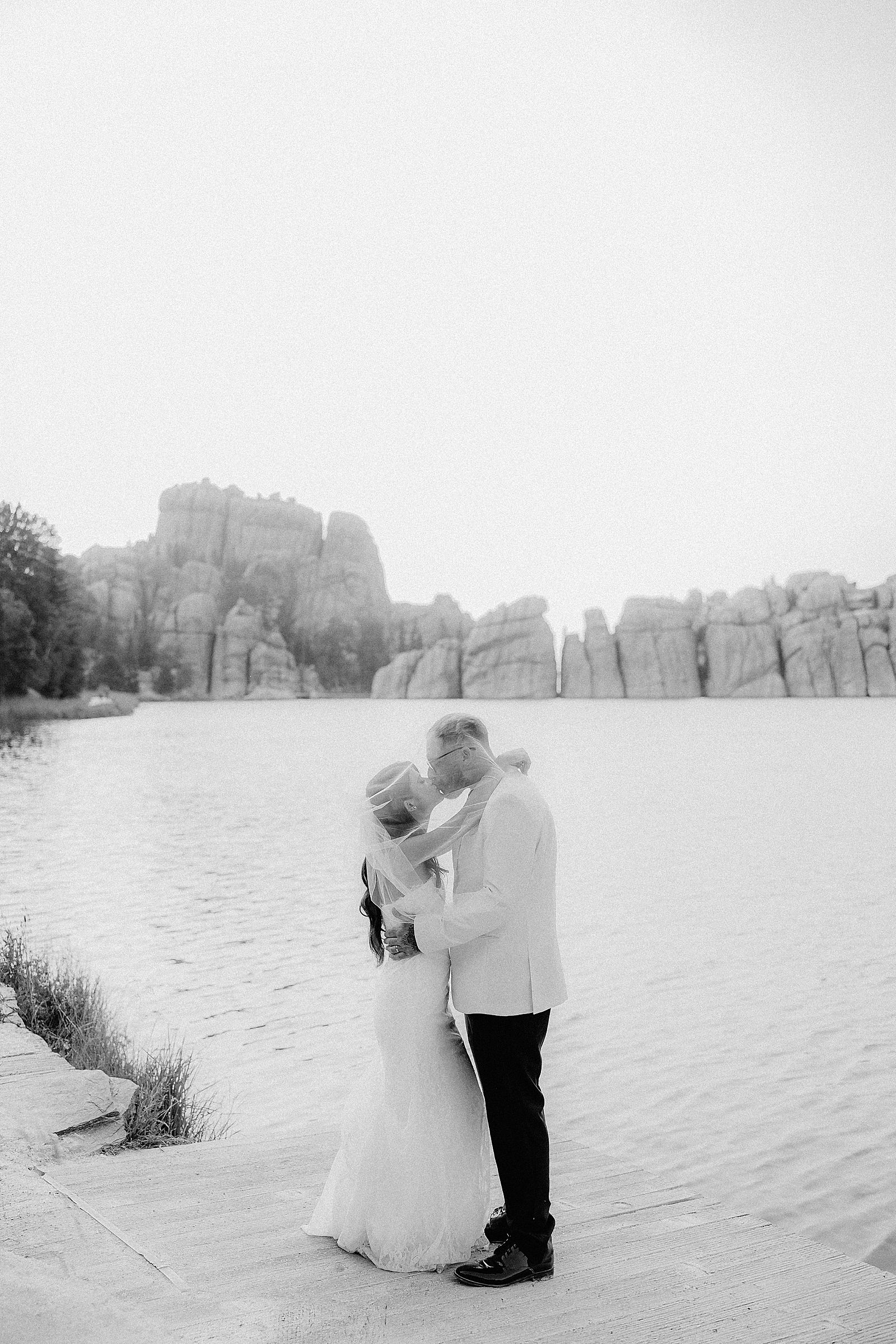 Phoebe and CJ surrounded by granite formations during their Sylvan Lake elopement