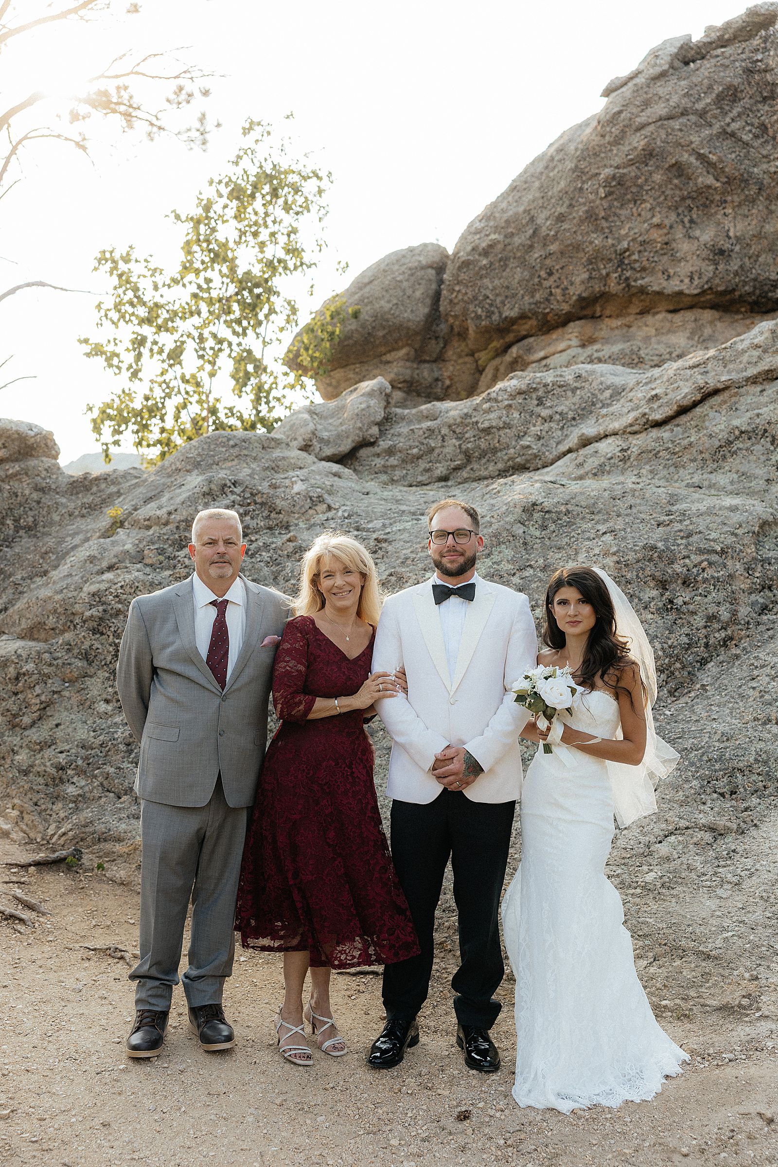 Family portraits along the shoreline after a Sylvan Lake elopement ceremony